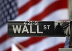 The Wall Street sign is seen outside the New York Stock Exchange, March 26, 2009. REUTERS/Chip East The Wall Street sign is seen outside the New York Stock Exchange, March 26, 2009. REUTERS/Chip East