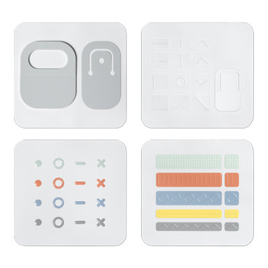 Pieces of the Microsoft Adaptive Kit are shown including cord markers, key markers and lid opener.