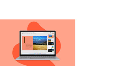 A front view of a Platinum Surface Laptop 5 in front of an orange coral color with a bright orange Back-to-school themed amoeba behind the device.