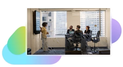Four people having a meeting in a conference room.