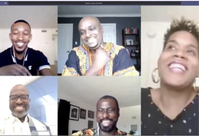 People on a Teams video call laughing.