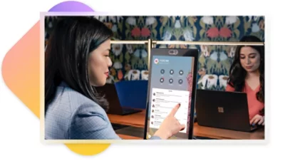 A person using a Teams display device to book a spot at a flexible workspace. 