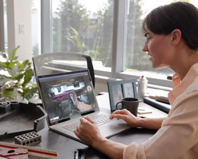 A person sitting at a desk using a computer