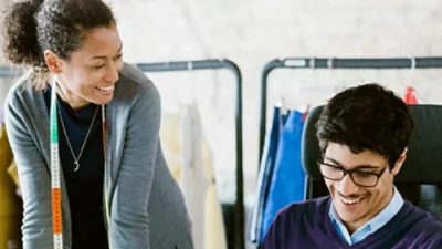 A man and women talking each other with smiling face