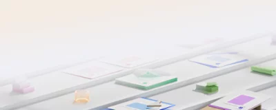 Various office supplies, including notebooks, sticky notes, tape rolls, and papers, organized on white shelves.