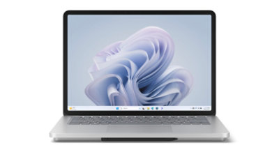 Surface Laptop Studio 2 shown from the front in Laptop Mode with a Windows bloom on screen.