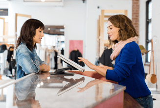 Sales woman helping a customer with a Chrome device
