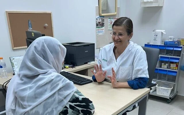 Dr. Nadia Heno, right, the first female Druze doctor in Israel, consults with a Druze woman in the Clalit health clinic in Julis, Western Galilee, on May 22, 2026. (Courtesy) Dr. Nadia Heno, right, the first female Druze doctor in Israel, consults with a Druze woman in the Clalit health clinic in Julis, Western Galilee, on May 22, 2026. (Courtesy)