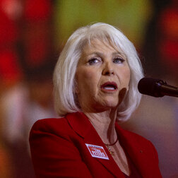 Tina Peters speaking into a microphone. 